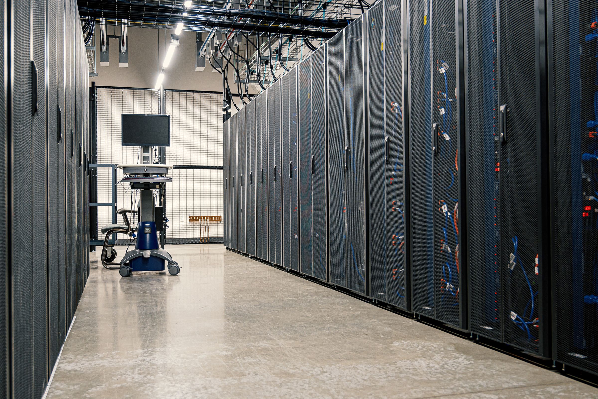 A data-center aisle: most of the time the problem is not here, it is in how the code asks for the data.